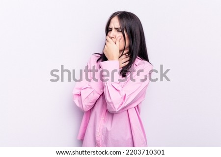 Young caucasian woman isolated on pink background suffers pain in throat due a virus or infection.