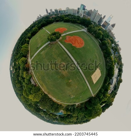 Aerial 360 degree panoramic view of Piedmont park, the ground and Atlanta skyline shot using a drone