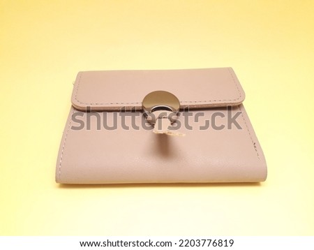 Mini wallet or small wallet, cream color, used by women to store shopping cards and others