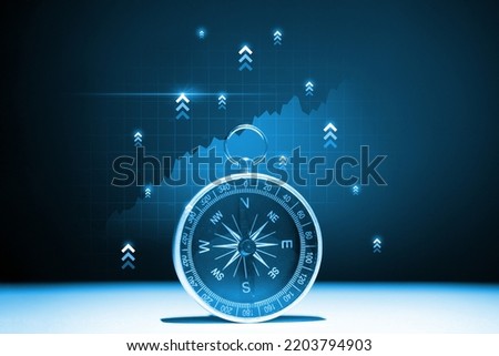 The concept of a successful way to invest and promote a business Compass with a hologram up arrows Royalty-Free Stock Photo #2203794903
