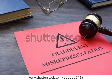 Papers about fraudulent misrepresentation in the court. Royalty-Free Stock Photo #2203806419