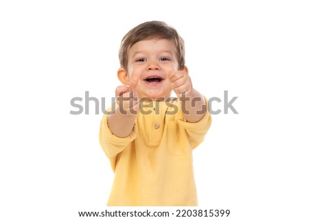 Cute baby showint his thumb isolated on a white backgorund