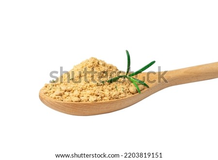 Soup powder in wooden spoon isolated. Instant powdered broth, bouillon concentrate with herbs and spices on white background side view, clipping path
