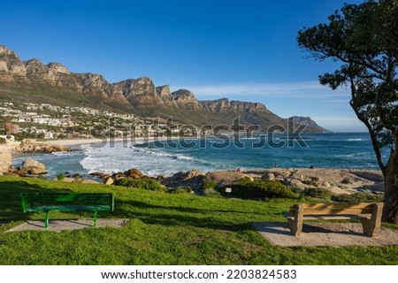 View of Camps Bay beach and Twelve Apostles from Maidens Cove. Cape Town, Western Cape, South Africa.