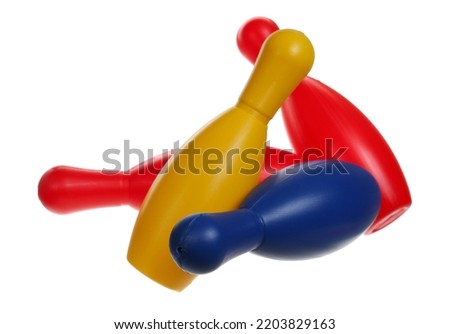 Colorful bowling pins in air, skittles isolated on white with clipping path