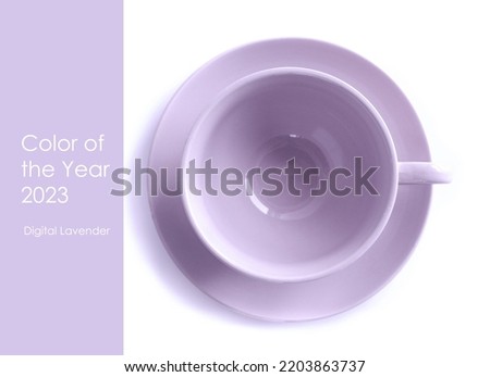 Flat lay of porcelain cup  on white background. Toned in trendy color digital lavender. Creative trendy photo, flat lay with space for text. Mock up. Text color of the year 2023 digital lavender Royalty-Free Stock Photo #2203863737