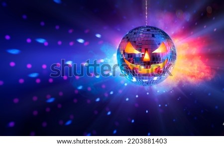 Halloween Mirror Ball In Disco - Pumpkins Face On Sphere In Nightclub With Smoke And Defocused Abstract Lights Royalty-Free Stock Photo #2203881403