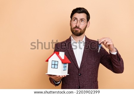 Photo of professional realtor manager look sell pretty home flat look empty space dreaming isolated on beige color background