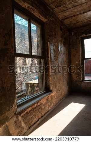 Abandoned building. An abandoned building illuminated by sun at daytime. Historical empty buildings.