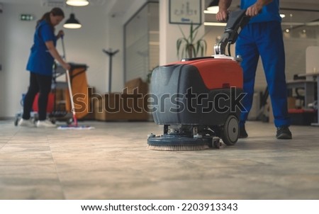 Machine washing of the hard floor in the office Royalty-Free Stock Photo #2203913343