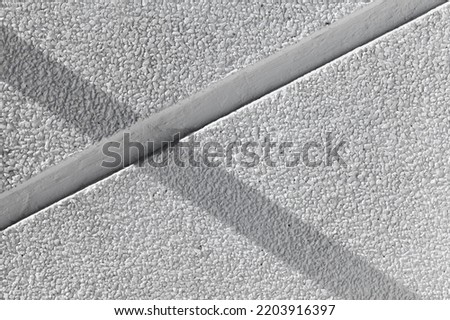 Empty white stone wall with shadow. Abstract background photo texture