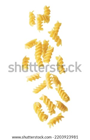 Spirals dried pasta on a white isolated background. toning. selective focus Royalty-Free Stock Photo #2203923981
