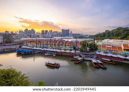 Aerial view cityscape of Clarke Quay, Singapore city skyline at sunset Royalty-Free Stock Photo #2203949445