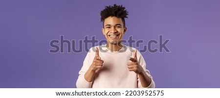 You got it. Close-up portrait of smiling cute young hispanic man saying good luck, pointing fingers at camera with pleased cute grin, encourage person apply for job, headhunter picking new candidates Royalty-Free Stock Photo #2203952575