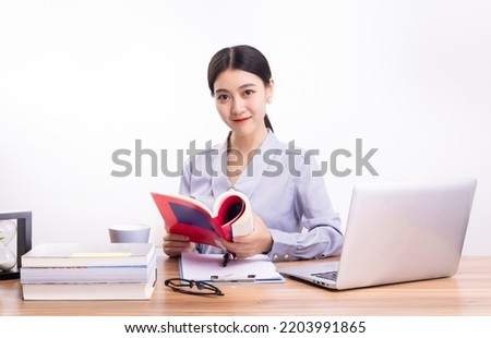 Business women reading at their desks