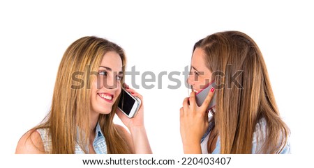 Friends talking to mobile over white background