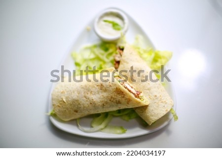 Arabic style Chicken Shawarma Wrap. Selective focus, A little depth of field along with copy space