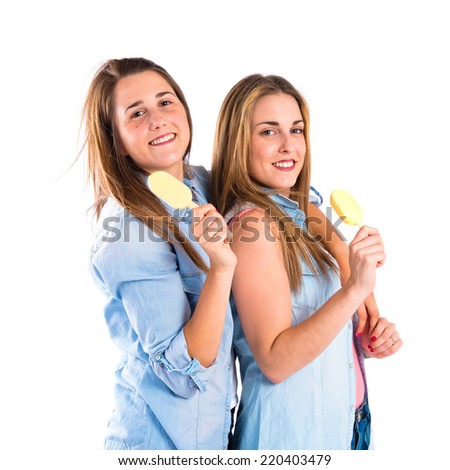 Friends eating ice cream over white background