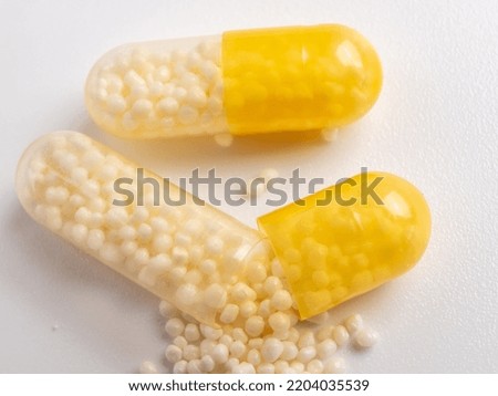 Vitamin C capsules on a white background. macro photography.