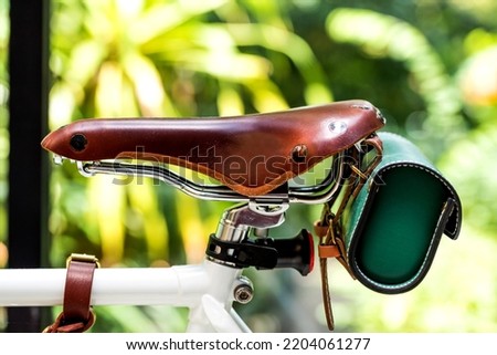 Vintage Classic Leather Bicycle Seat With Leather Bike Saddle Bag On Bicycle Background