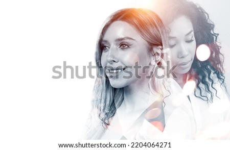 Multinational businesswoman working together, two portrait silhouettes on white empty background. Concept of communication and network. Copy space