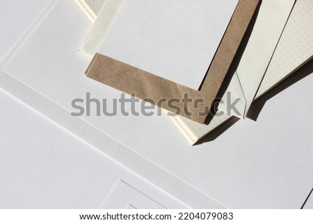 Studio Workplace Desk with Paper  Sheets, Envelopes, Cards. Aesthetic Neutral Business Flatlay with Copy Space.
