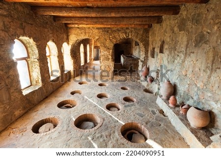 Wine cellar with kvevri wine pots at ancient Nekresi monastery winery in Kakheti. Kakheti is a region in eastern Georgia with Telavi as its capital. Royalty-Free Stock Photo #2204090951