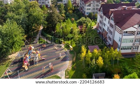 Aerial Children's playground. View of colorful playground in city park. Empty modern outdoor playground in springtime. Beautiful place for kids games and sport