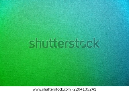 Green turquoise teal blue abstract texture background. Color gradient. Colorful matte background with space for design. Toned canvas fabric. Empty. Blank.