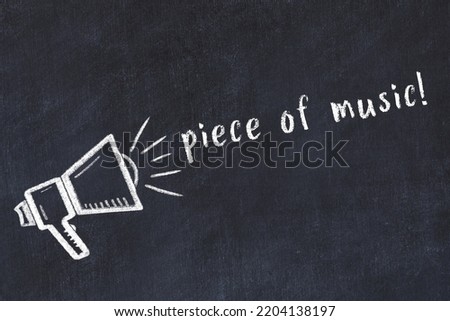 Black chalkboard with drawing of a loudspeaker and inscription piece of music