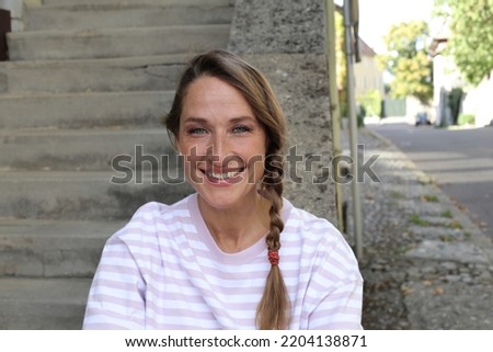 Woman with a cute causal hairstyle  Royalty-Free Stock Photo #2204138871