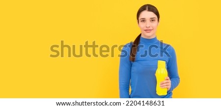 Woman isolated face portrait, banner with copy space. be hydrated. smiling woman hold mineral water. feel thirsty. young girl with sport plastic bottle. Royalty-Free Stock Photo #2204148631