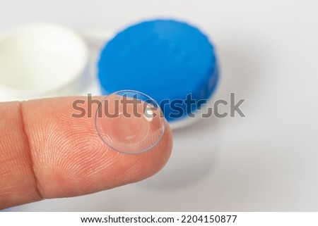 Soft contact lens on the finger, close-up Royalty-Free Stock Photo #2204150877