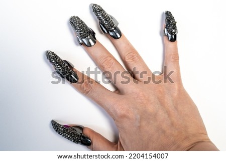 beautiful female hand with manicure on white background, nail decor jewelry, art design, creative accessories 