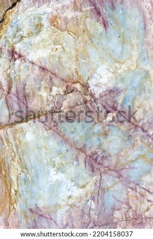 Natural stone marble rock surface by the stream