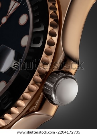 Beautiful elegance gold watch. Close up view of a watch with dark background