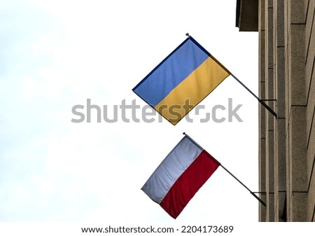 The flag of Poland and Ukraine together on the facade of building. Its a symbol of opposition to Russian aggression, a sign of solidarity and help Ukraine