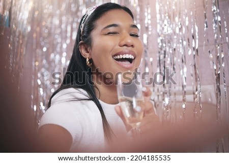 Selfie, birthday party and celebration woman with champagne or sparkling wine glass for festival event. Happy, smile and Mexico girl celebrate and take photography with interior decoration background