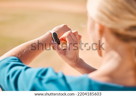Wellness woman and smartwatch with health monitor and gps technology for outdoor fitness safety. Girl checking digital sport accessory with exercise tracker for athlete lifestyle wellbeing. Royalty-Free Stock Photo #2204185603
