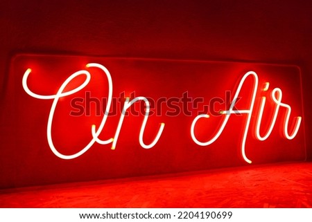 Red neon sign on air. Trendy style. Neon sign. Custom neon. Home decor.