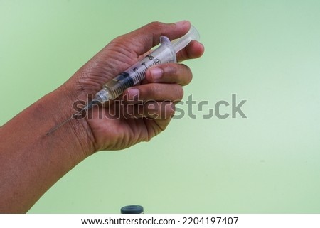 Drugs concept. Disease concept. Drug addict man with syringe using drugs. He would drug addiction.