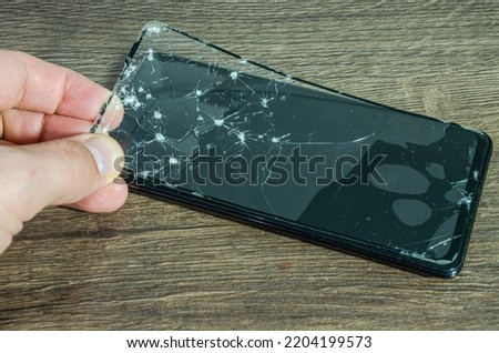 Cracked, broken screen on smartphone