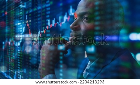 Portrait of Black Stock Market Trader Doing Analysis of Investment Charts, Graphs, Ticker Numbers Projected on Face. African American Financial Analyst, Digital Entrepreneur Successfully Trading Royalty-Free Stock Photo #2204213293