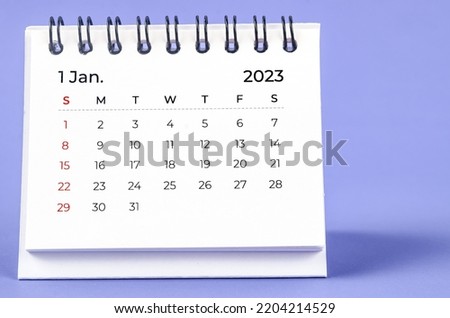 January 2023 Monthly desk calendar for 2023 year on purple background. Royalty-Free Stock Photo #2204214529
