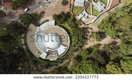 aerial view of the snail building girded by trees in Bogota Colombia Royalty-Free Stock Photo #2204227773