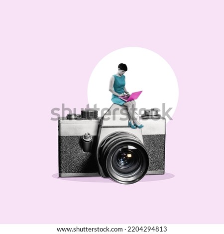A woman with a laptop is sitting on the photo camera.