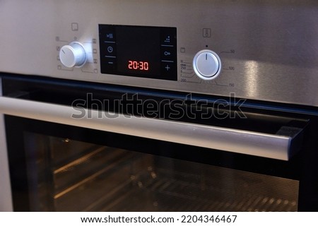 Glowing burner of the electric hotplate on black background Royalty-Free Stock Photo #2204346467