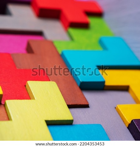 The concept of logical thinking. Geometric shapes on a wooden background.