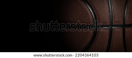 Closeup detail of basketball ball texture background. Horizontal sport theme poster, greeting cards, headers, website and app Royalty-Free Stock Photo #2204364103