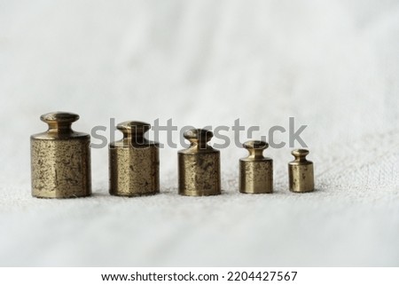  golden scale in whtie background weigth scale calibration bullets on white background